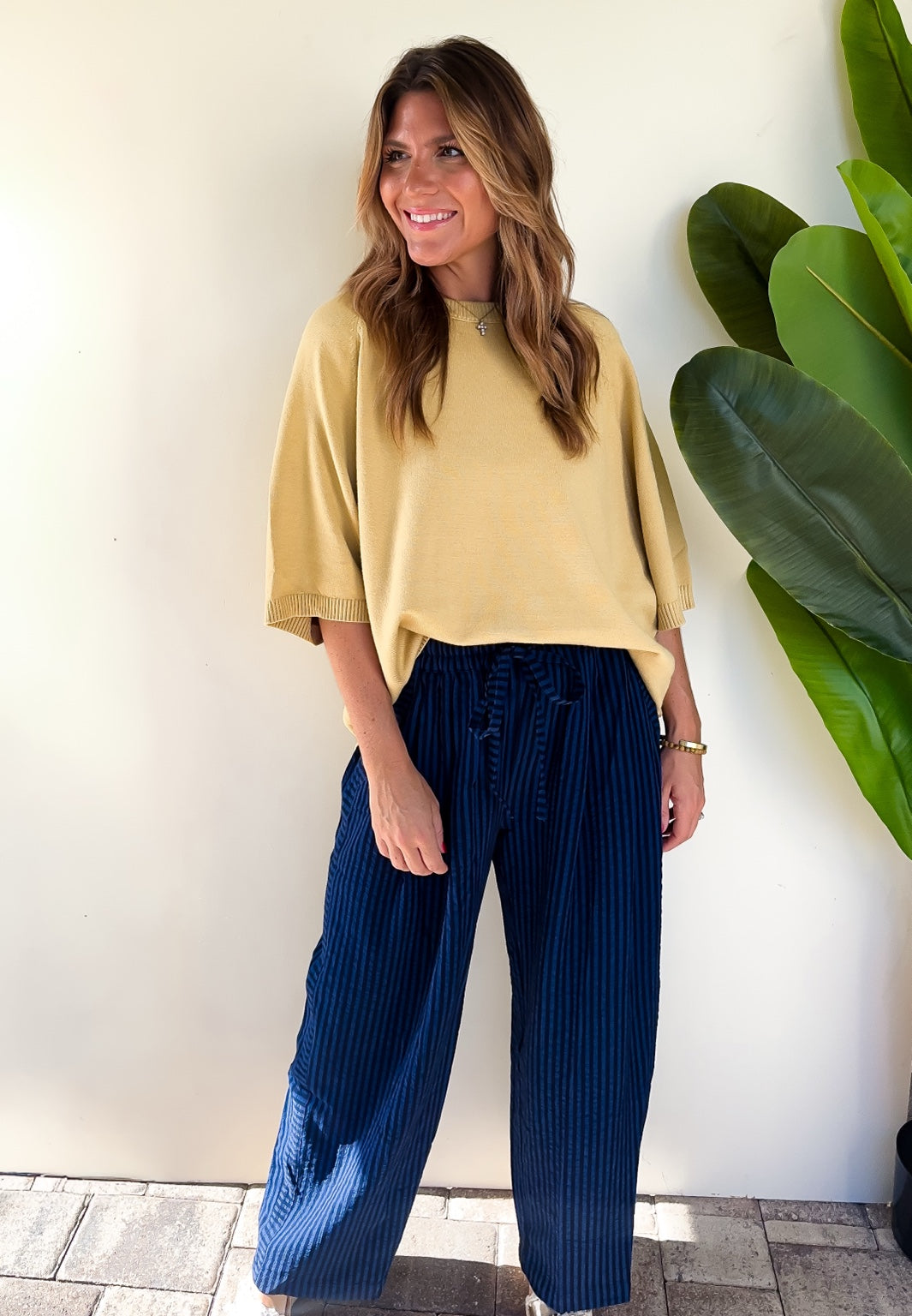 After Hours Stripe Pants styled with the Sunlit Stroll Dolman Sweater.