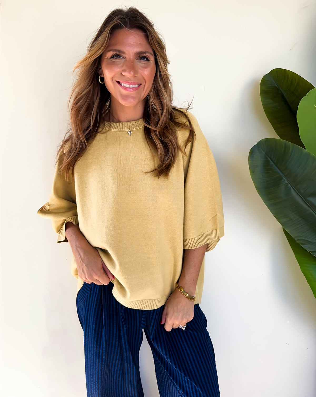 Front view of the Sunlit Stroll Dolman Sweater in willow with ribbed neckline and hem.